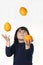 Juggler child with oranges