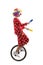 Juggler clown riding a unicycle and juggling