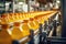 Juice bottling plant: automated machinery on a conveyor, producing sweet orange beverages