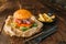 Juice burger with steak on wooden table closeup