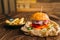 Juice burger with steak on wooden table closeup