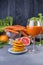 Juice from fresh carrots and grapefruit in a glass and fragrant pancakes for breakfast. vitamin drink for a healthy diet. Vitamins