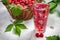 Juice from freshly harvested raspberries served with ice