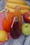 Juice Glasses of freshly Fruit juice with colorful fruits on Rustic Gray wooden Background. Healthy Food Concept.