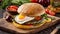 Juicy appetizing burger sesame seeds, a beef , fried egg and vegetables cooked