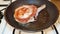 Juicy appetizing pork steak in a frying pan