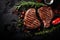 Juicy beef steak with rosemary on a dark background. Top view