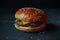 Juicy cheeseburger on a dark background
