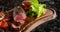 Juicy chopped steak chateaubriand of marbled veal with vegetables on a wooden board
