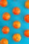 Juicy citrus tangerines on a blue background