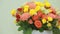 Juicy, colorful bouquet of pink, yellow, red and orange roses, close-up