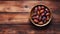 Juicy dates in a traditional bowl on wooden table