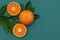 Juicy and delicious orange spread on fresh orange leaves. ornament, symbol, pattern.save space. top