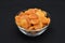 Juicy dried apricots in a white ceramic bowl. Dried apricot fruit halves without a stone