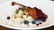 Juicy Duck confit, Roasted duck leg with vegetables, sauce, microgreens and berries