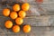 Juicy fresh clementines on a rustic wooden table