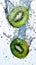 Juicy fresh kiwi halves flying with splashes of water. Levitating fruit concept