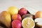Juicy fruit close-up, healthy foods, diet ingredients, kiwi slices near lemon and juicy peaches