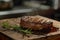 Juicy grilled steak with fresh rosemary on wooden board