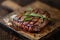 Juicy grilled steak with fresh rosemary on a wooden board