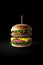 Juicy hamburger against dark background