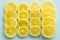 Juicy and healthy lemon slices / blue glass background