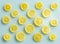 Juicy and healthy lemon slices / blue glass background