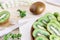 Juicy kiwi slices on a wooden plate on the table close-up, delicious fruit wood, dietary products, healthy ingredients, tropical f