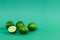 Juicy limes on a green background