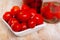 Juicy marinated tomatoes on a white plate. Homemade canning.