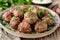 Juicy Meatballs Garnished with Parsley in a Decorative Ceramic Plate for Culinary Websites