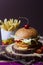 Juicy mexican burger, hamburger or cheeseburger with one chicken patties, with sauce,french fries and cold drink. Concept of