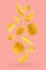 Juicy oranges as flow fly or fall as art composition. Whole, half, quarter pieces fruits on pastel pink background with shadow.