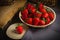 Juicy organic strawberries on gray tablecloth with copy space on background