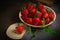 Juicy organic strawberries on gray tablecloth with copy space on background