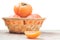 Juicy persimmon slice with blurred fruits in
