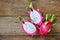 Juicy pink pitaya on wooden table