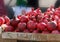 Juicy pomegranates in a box on the market