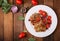 Juicy pork steak with rosemary and tomatoes