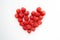 Juicy raspberries heart shaped composition