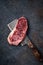 Juicy Raw new York beef steak on a wooden meat axe