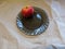 Juicy red florina apple on a black plate