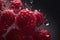 Juicy red raspberries with water droplets on a dark background.