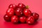 Juicy and ripe cranberry fruit, high quality isolated image on a vibrant red background