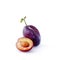 Juicy ripe plum. Large purple plum with a leaf and half with a bone inside