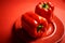 Juicy shiny bell pepper on a red background