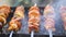 Juicy shish kebab in the grill outdoors, pieces of meat on coals, close-up.