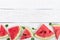 Juicy slices of a ripe watermelon on a white wooden background. Berry food background