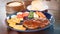 A juicy steak with tomato sauce drizzled over the beef was served on a plate with bread and salad