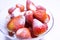 Juicy strawberry fruit in sugar sand in bowl on white background